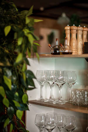 Different empty clean glasses on counter in barの写真素材