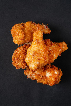 fried chicken on the black backgroundの写真素材