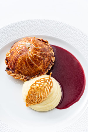 Tenderloin with pork, mushrooms and sirloin puff pastry on a white background. Homemade meal for...