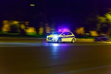 Police flasher control blue flashing lights of car accident danger at night.の写真素材