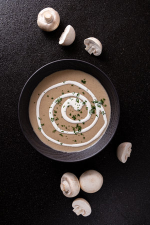 mushroom cream soup on the black backgroundの写真素材