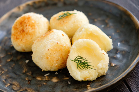 fried mozzarella balls on white plateの写真素材