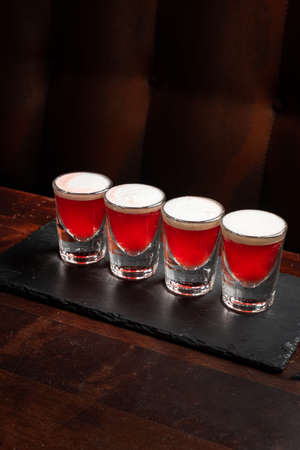 cranberry shots in the barの写真素材