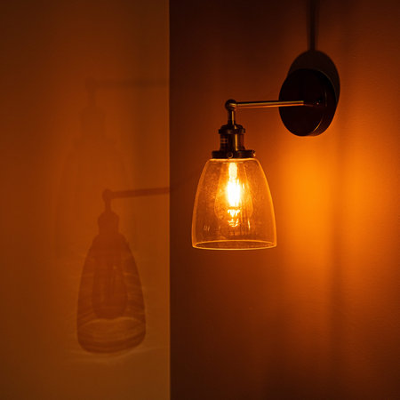 Vintage golden light bulb with shine light on dark background.