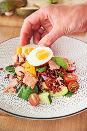 red rice with vegetables and tunaの写真素材