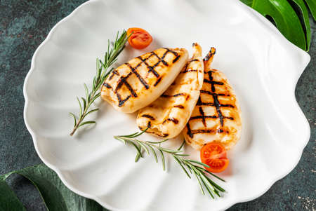 grilled calamari served on the white plateの写真素材