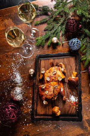 Christmas chicken and champagne on the tableの写真素材