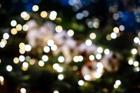 Abstract glittering Christmas background with lightsの写真素材