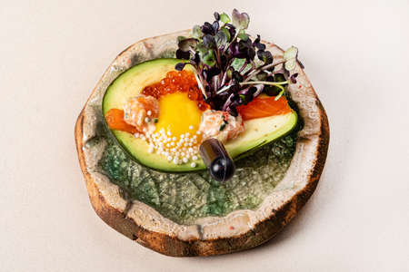 Homemade Organic Egg Baked in Avocado with Salt and Peppeの写真素材