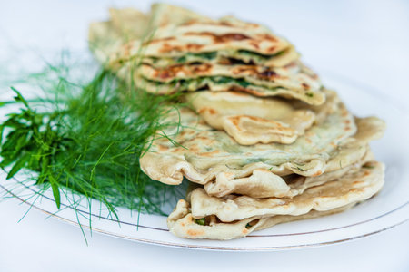 Healthy vegetarian food, homemade healthy lunch with vegetables and herbs: leek, onions and...