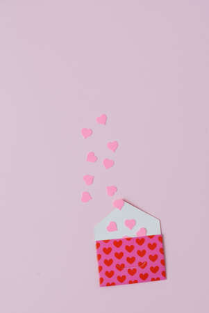 envelope with hearts on pink backgroundの写真素材