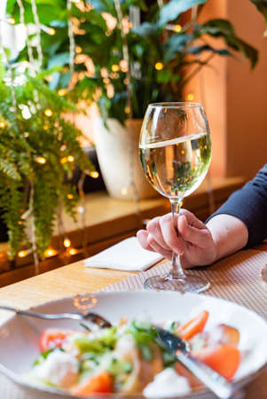dinner with wine in the restaurantの写真素材