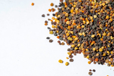 Pile of bee pollen on white