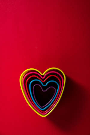 heart's shapes on the red backgroundの写真素材