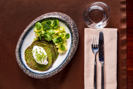 Delicious vegetarian pancakes with yogurt sauceの写真素材