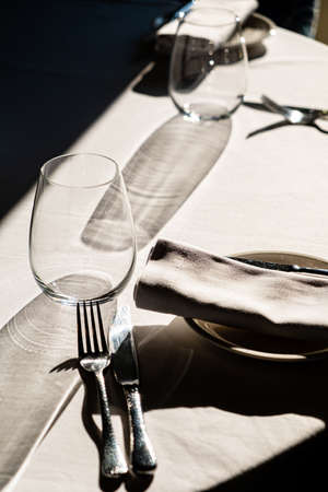 glasses on empty restaurant table in contemporary restaurantの写真素材