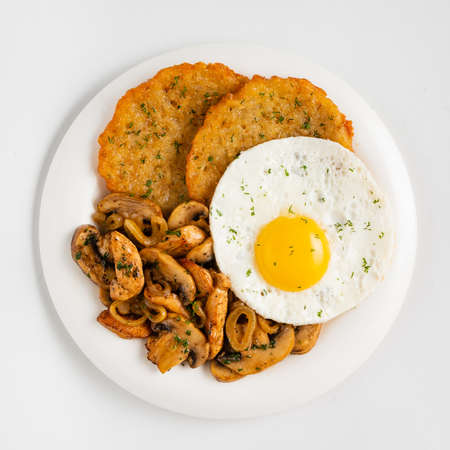 potato pancakes with egg and mushroomsの写真素材
