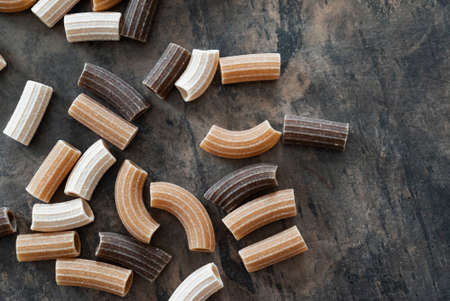 wholegrain pasta on the tableの写真素材