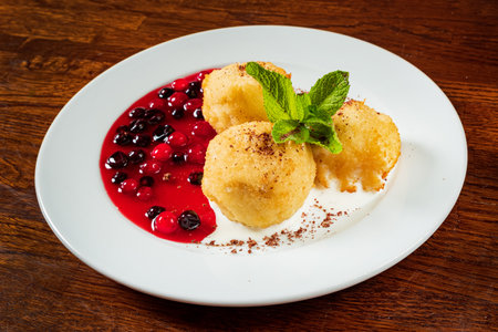 baked balls with berry compoteの写真素材