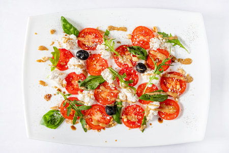 caprese salad in the white plateの写真素材