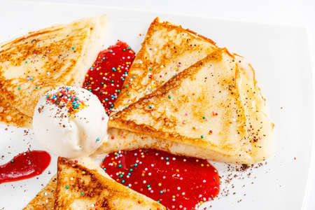 pancakes with ice cream and syrupの写真素材