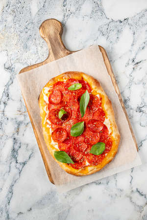 italian pizza on the wooden boardの写真素材