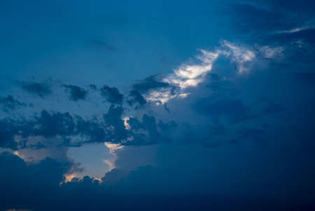 Beautiful blue cloudy sky with lightsの写真素材