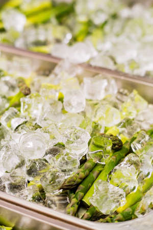 organic asparagus on the ice cubesの写真素材