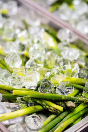 organic asparagus on the ice cubesの写真素材