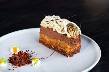 tasty cake with vanilla cream on white plate