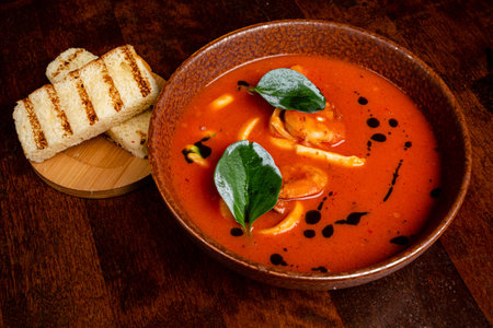 tomato soup on the wooden tableの写真素材