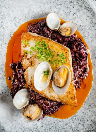 Fried fish fillet. Cod with sauce and herbs