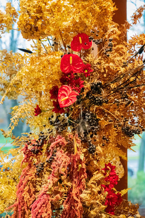 dry flowers bouquet near windowの写真素材