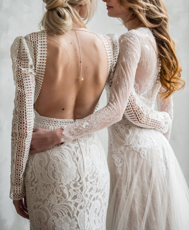 Two young girls of the bride embrace.の写真素材