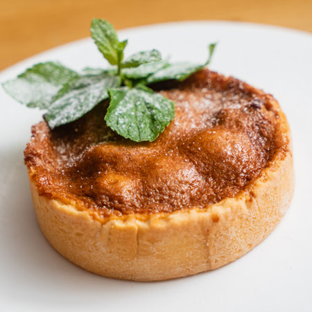 tartlets pastries with almond frangipane and powdered sugarの写真素材
