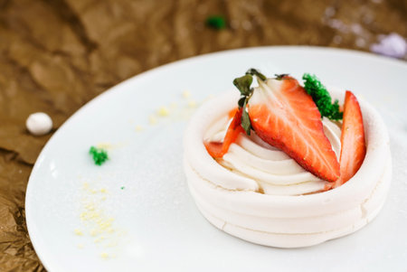 strawberry pavlova cake on white plateの写真素材