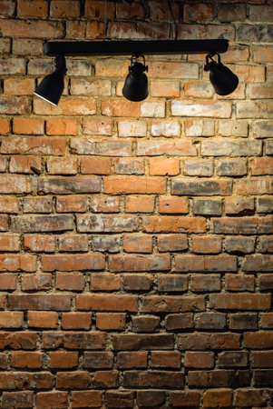 Old brick wall with stage lightsの写真素材