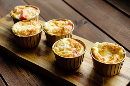 Cheese egg souffle on wooden backgroundの写真素材