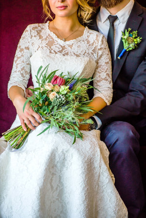 Baeutiful wedding couple with flowersの写真素材
