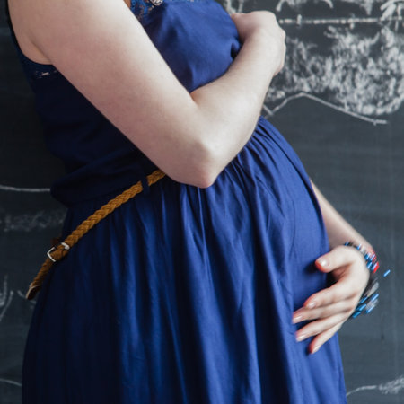 pregnant woman in blue dressの写真素材