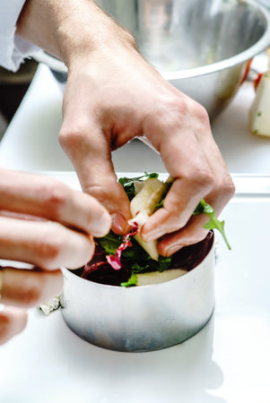 chef making salad in restaurant