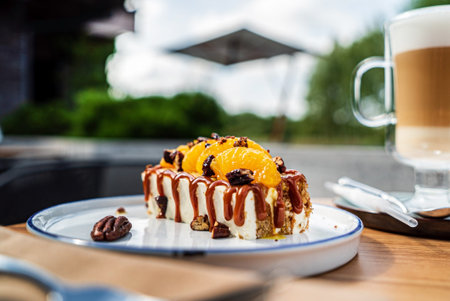 luxury cake and cappuccino on the summer terrace