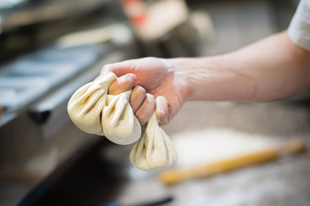 Raw Khinkali with meat on a wooden boardの写真素材