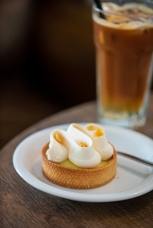 iced coffee with pastry in cafeの写真素材
