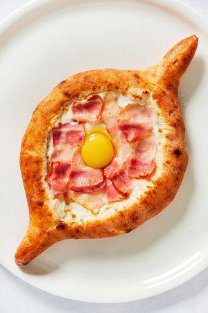 Adjarian khachapuri on the white plateの写真素材