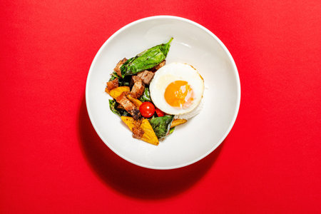 rice with fried egg and vegetablesの写真素材