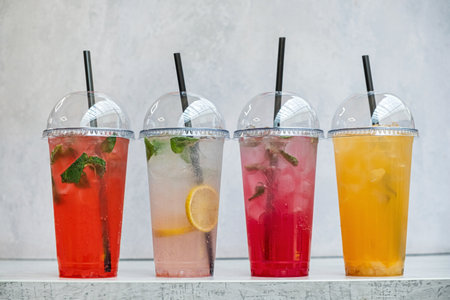 summer drinks in the plastic cupsの写真素材