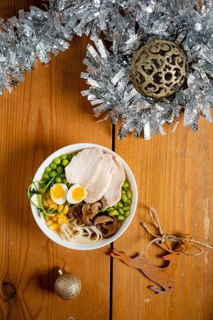 Bowl of asian noodle soup with egg and green onionの写真素材