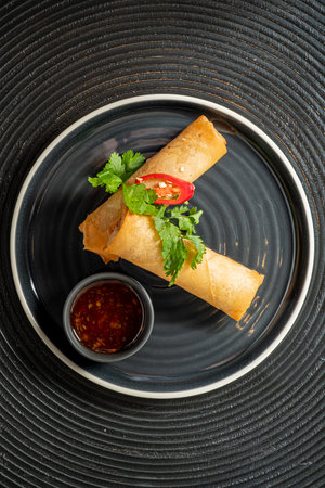 spring rolls on the black plateの写真素材