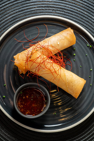 spring rolls on the black plate